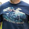 Close-up of navy blue t-shirt with mountain biker, bear, and Bulgarian slogan “Mechka strah, men ne!” – fearless adventure design.