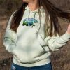 Light green hoodie with an embroidered bear design featuring a scenic mountain landscape.