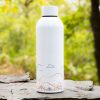 Minimalist aluminum bottle with a mountain-inspired design. Lightweight, durable, and leak-proof.