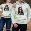 hoodie-sweatshirt-zelen-cvyat-menta Light green hoodie featuring a colorful bear and mountain design, worn by a smiling couple outdoors.