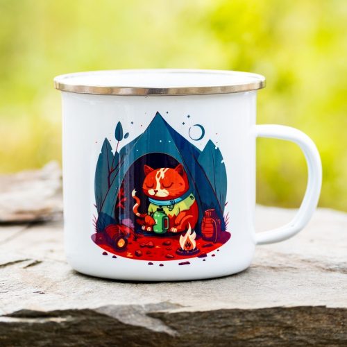 White enamel camping mug featuring an illustration of an orange cat sitting in front of a tent, sipping a hot drink by a small campfire, surrounded by trees and a night sky.
