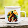 White enamel camping mug with a colorful illustration of a dog sitting by a campfire in front of a tent and mountains.