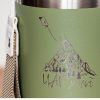 Close-up of a green stainless steel thermal mug with a laser-engraved mountain design and the text "Чай малко." The illustration depicts a tea bag as a kite flying over the mountain.