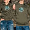 Olive green hoodie with an embroidered mountain night sky design, perfect for outdoor lovers.