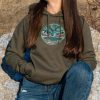 Olive green hoodie with an embroidered Northern Lights design, featuring a cozy fit and eco-friendly fabric.