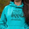 not-bad-trails-just-bad-knee turquoise women's hoodie with quote “No bad trails just bad knees” and embroidered mountain hikers design