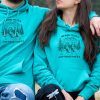 unisex-hoodie-sweatshirt-zelen-mechki turquoise hiking hoodie with quote “No bad trails just bad knees” and mountain hiker illustration, unisex model