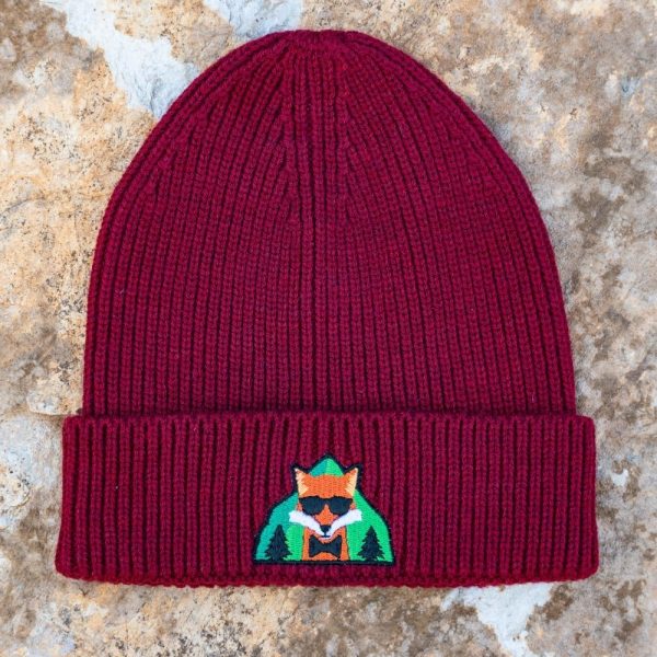 burgundy knitted winter beanie with fox and forest embroidery, made of 50% acrylic and 50% recycled polyester, unisex one size