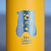 Close-up of laser-engraved bear holding a cup with the text “Bez drama” on a yellow metal thermos.