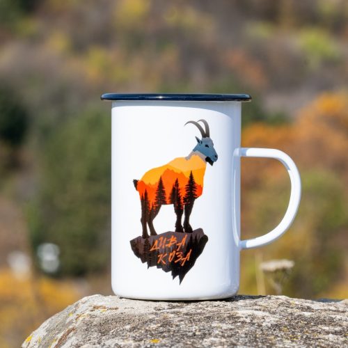 White enamel mug with sunset-style wild goat silhouette and pine forest illustration.