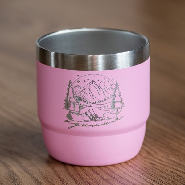 Pink mini insulated coffee cup with laser-engraved mountain and hiker design.