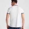 Back view of a premium white cotton polo shirt with navy contrast collar and sleeve details made from heavyweight 230 gsm cotton